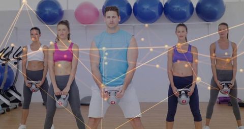 Group kettlebell training in gym with digital nodes overlay