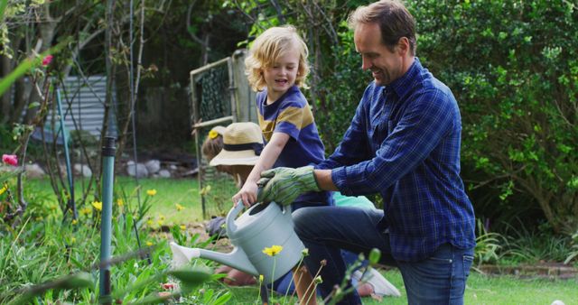 Father and son gardening together on a sunny day - Download Free Stock Images Pikwizard.com