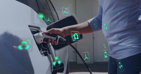 Charging electric car with futuristic eco-friendly icons
