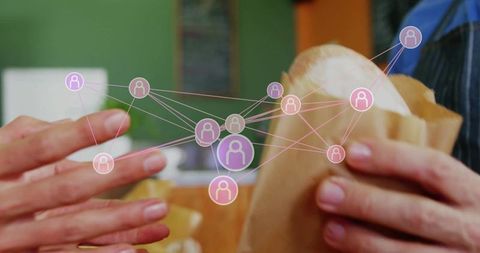 Hands exchanging wrapped sandwich over cafe counter with digital network connection overlay