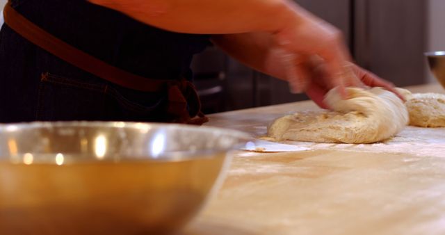 Baker Kneading Dough on Floured Surface in Kitchen - Download Free Stock Images Pikwizard.com