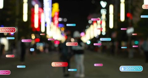 Night city street with augmented reality tags, walking silhouettes and neon data overlays