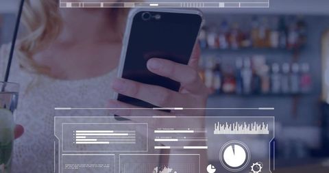 Young woman holding smartphone and cocktail with holographic analytics overlay in bar