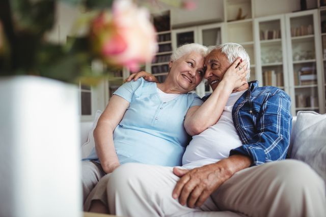 Senior couple embracing at home - Download Free Stock Photos Pikwizard.com