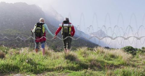 Senior Hikers Holding Hands on Mountain Trail Adventure