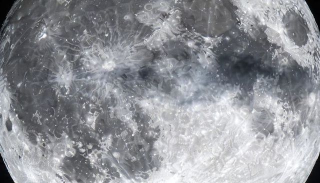 Full moon closeup revealing crater rays and lunar mare showing ejecta patterns high resolution