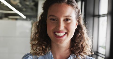 Happy Businesswoman Smiling in Modern Office