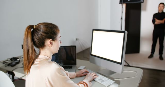 Female Designer Working on Computer in Photography Studio - Download Free Stock Images Pikwizard.com