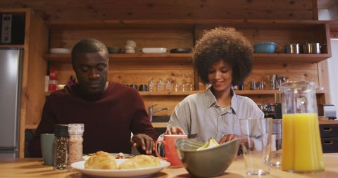 Couple Enjoying Breakfast in Cozy Home Kitchen