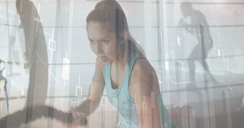 Woman powering intense battle-rope workout with fitness data overlay and determined focus