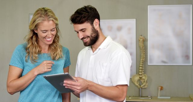 Physical Therapist Consultation with Smiling Patient - Download Free Stock Images Pikwizard.com