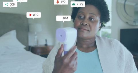 Woman testing infrared thermometer with social media engagement