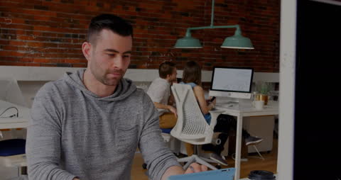 Focused Man Analyzing Data with Mathematical Equations Overlay