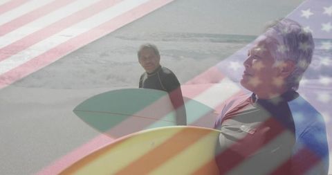Senior Couple Surfing with Flag Overlay Emphasizing Spirit of Adventure and Unity