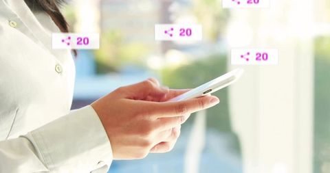 Asian Businesswoman Engaging on Smartphone with Social Media