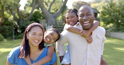 Happy Family Bonding Outdoors in Lush Green Garden - Download Free Stock Images Pikwizard.com