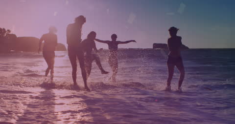 Group of Friends Enjoying Vibrant Summer Sunsets at the Beach