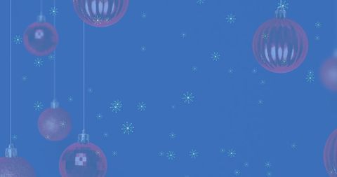 Festive Christmas Baubles and Falling Snow on Wintery Blue Background