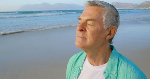 Senior Man Enjoying Peaceful Beach Ambience Close to the Sea - Download Free Stock Images Pikwizard.com