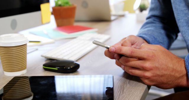 Close-Up of Person Using Smartphone at Office Desk - Download Free Stock Images Pikwizard.com