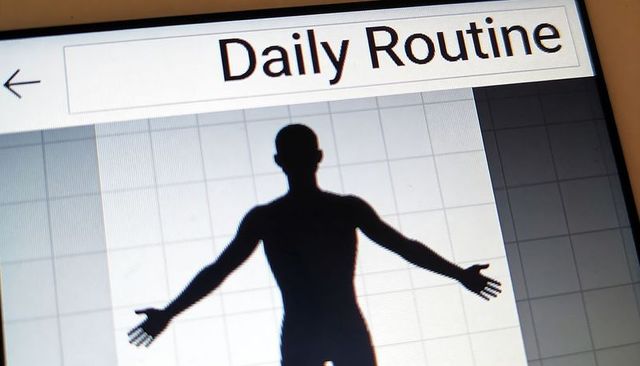Daily routine dashboard displaying human silhouette on tablet device for fitness tracking