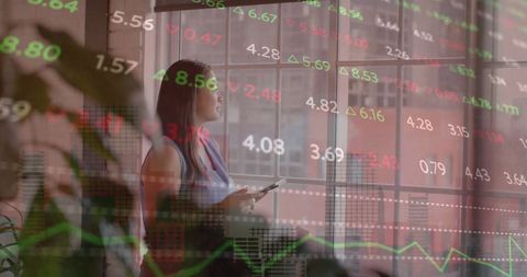 Businesswoman Analyzing Financial Data in Contemporary Office