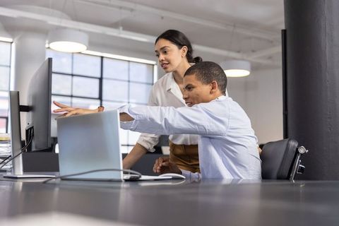 Diverse Colleagues Engaging in Focused Project Collaboration