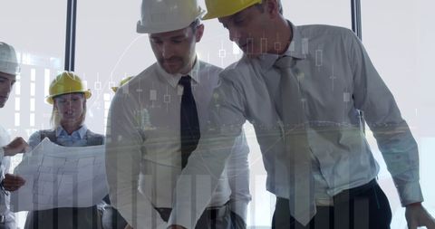 Architects Analyzing Plans with Graph Overlay During Meeting - Download Free Stock Images Pikwizard.com