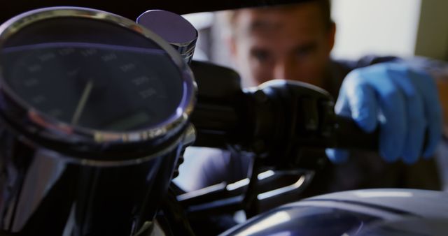 Mechanic Adjusting Motorcycle Handlebar with Tachometer in Focus - Download Free Stock Images Pikwizard.com