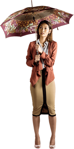 Businesswoman holding patterned transparent umbrella