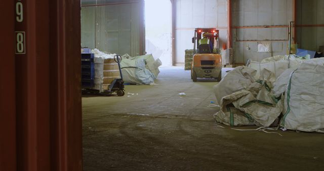 Forklift Operating in Industrial Warehouse with Random Stacked Items - Download Free Stock Images Pikwizard.com