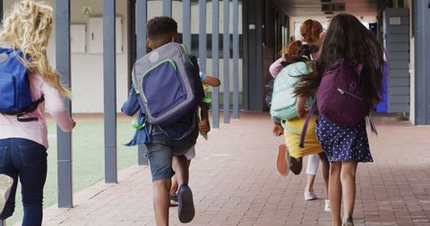 Joyful Schoolchildren Running Together with Backpacks - Download Free Stock Images Pikwizard.com