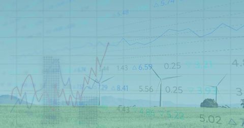 Wind turbines rotating over green field with data overlay highlighting renewable energy trends