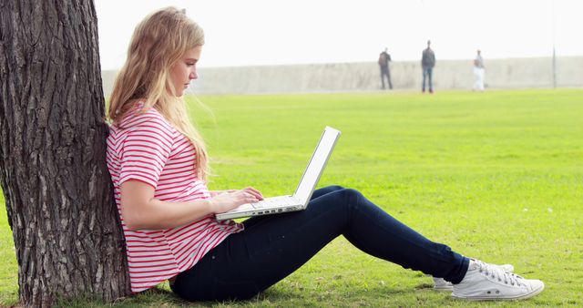 Young Woman Studying with Laptop Outdoors on Campus Lawn - Download Free Stock Images Pikwizard.com