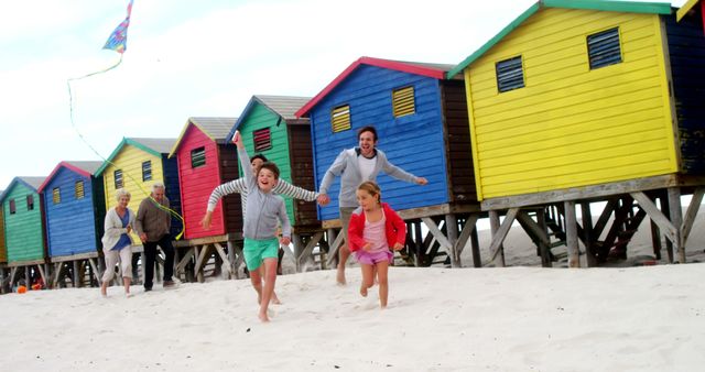 Family Enjoying Day at Colorful Beach - Download Free Stock Images Pikwizard.com