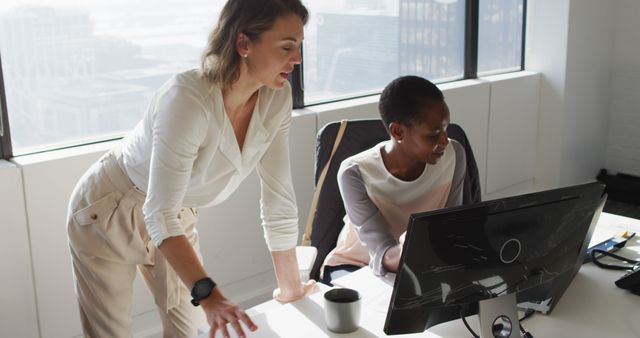 Two Female Colleagues Working Together in Modern Office - Download Free Stock Images Pikwizard.com