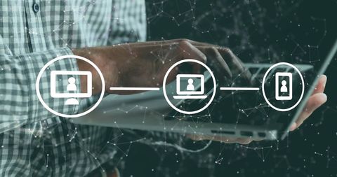 Man using digital tablet under technology graphics overlay