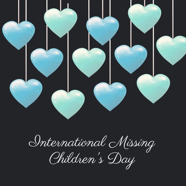 Blue and green hearts hang on strings over a black background, representing hope and unity for International Missing Children's Day. Can be used for social media awareness campaigns, event promotion, and educational materials.