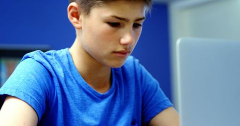 Focused Student Learning on Laptop in Classroom Setting