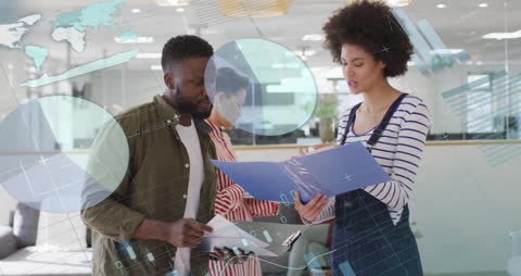 Diverse Colleagues Engaging in Office Data Analysis Discussion