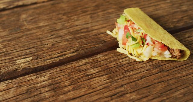 Image of freshly prepared tacos lying on wooden background. cuisine, cooking, food preparing, taste and flavour concept.
