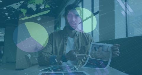Pointing beanie-wearing man presenting printed reports with digital analytics overlays