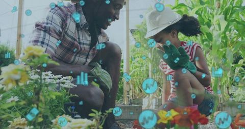 Parent and child gardening in greenhouse teaching sustainable growing with data overlay