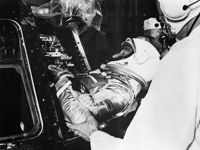 S62-02846 (24 May 1962) --- Project Mercury astronaut M. Scott Carpenter, prime pilot for the Mercury-Atlas 7 (MA-7) mission, is assisted into the MA-7 spacecraft by techicians at Launch Pad 14, Cape Canaveral, Florida. MA-7 is the United States? second attempt in orbital flight around Earth. The spacecraft was designated the ?Aurora? 7. Photo credit: NASA