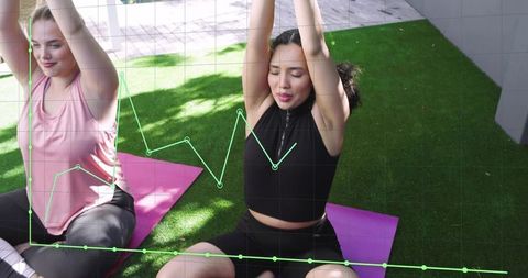Women practicing yoga on turf with fitness data overlay and grid for wellness tracking
