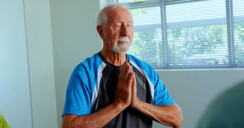 Senior Man Practicing Yoga and Meditation in Fitness Studio - Download Free Stock Images Pikwizard.com