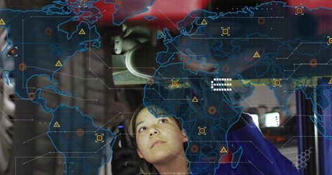Female technician inspecting machinery with ar global diagnostics map overlay