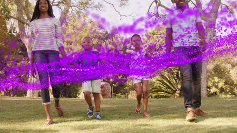 Family Walking in Park with Magical Purple Particles