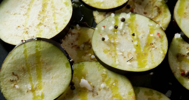 Close-up of eggplant slices flavored with spices 4k