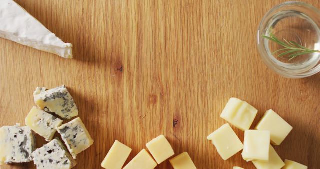 Variety of Cheeses and Rosemary Herb on Wooden Table - Download Free Stock Images Pikwizard.com